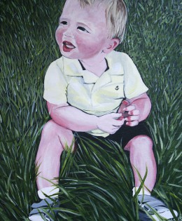 Cute little boy in the grass